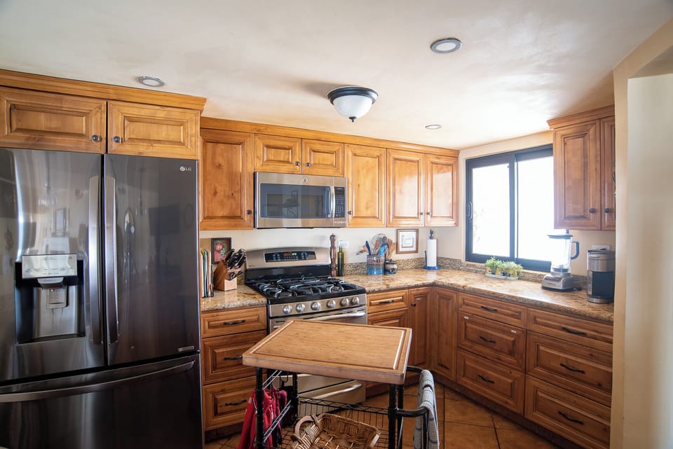 Well-equipped kitchen.  Coffee pot, blender 