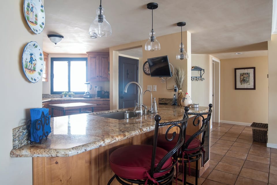 Bar looking into the kitchen.  Sit and visit with your friends.