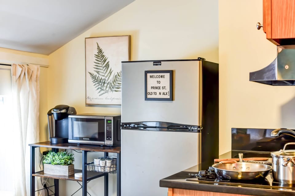 Start your mornings right with fresh coffee or warm up a quick meal, this kitchenette keeps it simple and convenient.