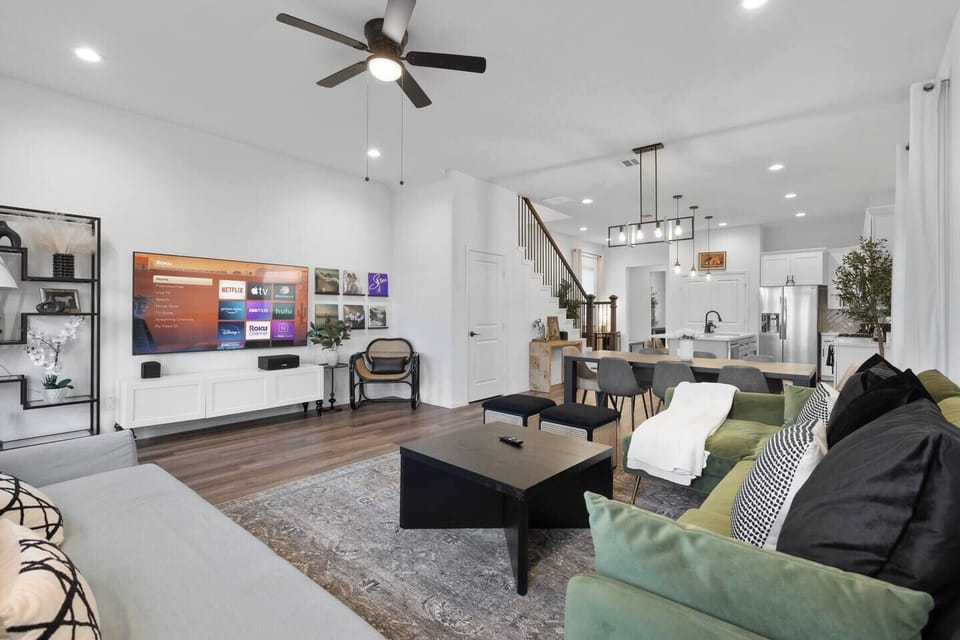 Living Room: Bright and airy space with a large Smart TV, perfect for movie marathons and socializing!