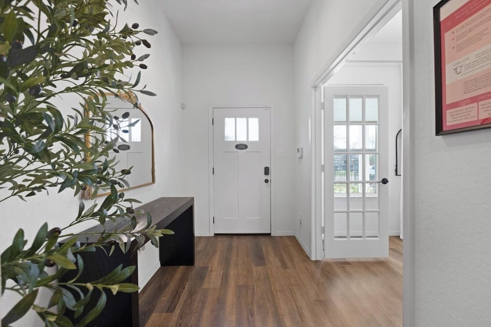 Welcoming entrance with secure keypad access, spacious foyer, and stylish decor setting the tone for your stay.