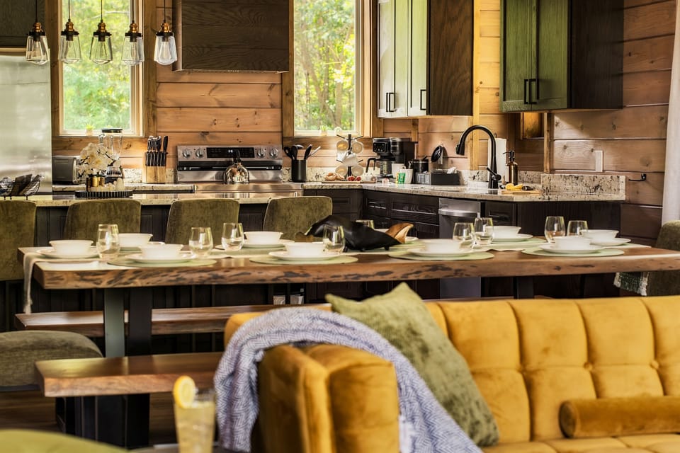 Open floor plan with stylish living room, dining area, and well stocked kitchen