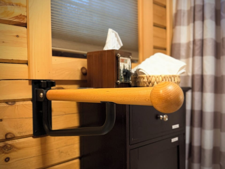 Bathroom: Fold-down grab bar at toilet.