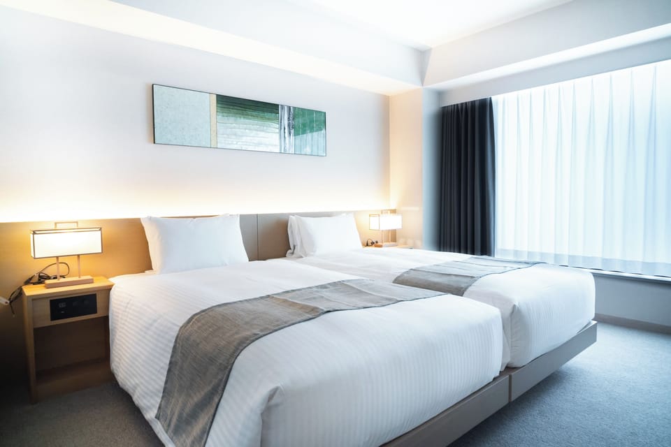 Deluxe Double or Twin Room | Down comforters, in-room safe, desk, laptop workspace