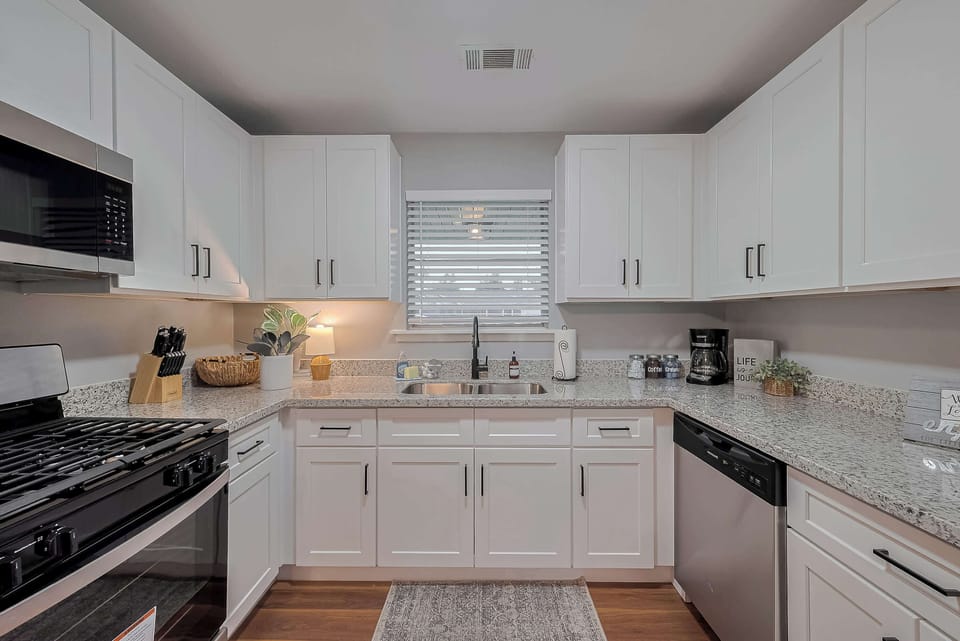 Kitchen: Whip up culinary delights in this stylish, sunlit space with modern appliances.
