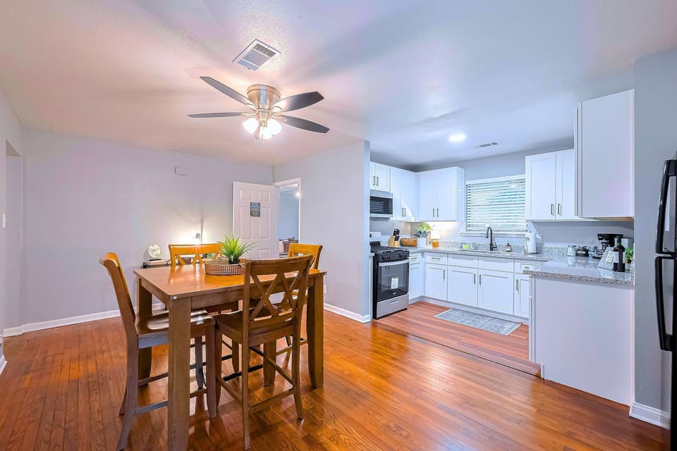 Dining Area: Bright space with wooden accents, perfect for meals and good times with friends.