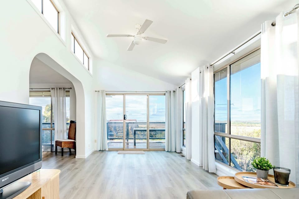 Enjoy beautiful scenery from the living room, framed perfectly by large windows