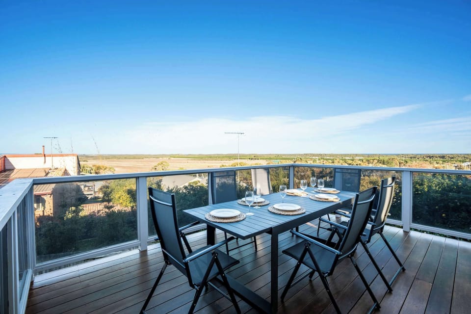 The outdoor deck is a standout feature, offering a private and peaceful view of the Ocean Grove dunes, perfect for long breakfasts, sunset dinners, or simply soaking in the serenity