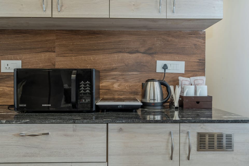 Family Room, Balcony, City View | Private kitchen