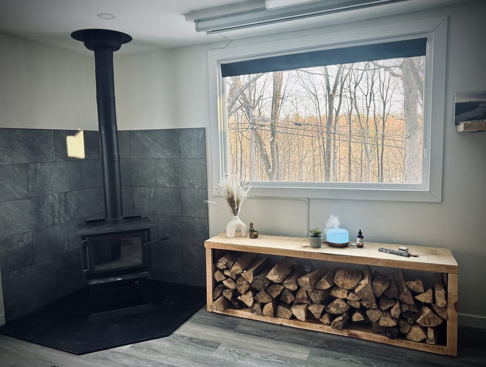 There is a rustic wood storage in the living room crafted by local artists and real wood burning stove. We provide firewood and kindlings for easy handling