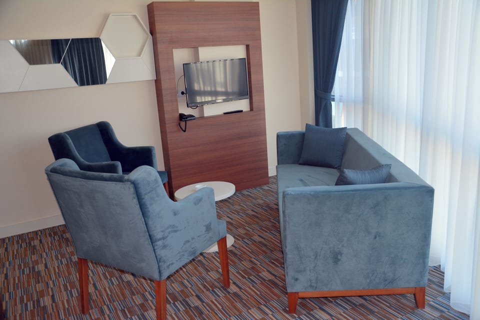 Deluxe Suite, City View | In-room safe, desk, laptop workspace, free WiFi