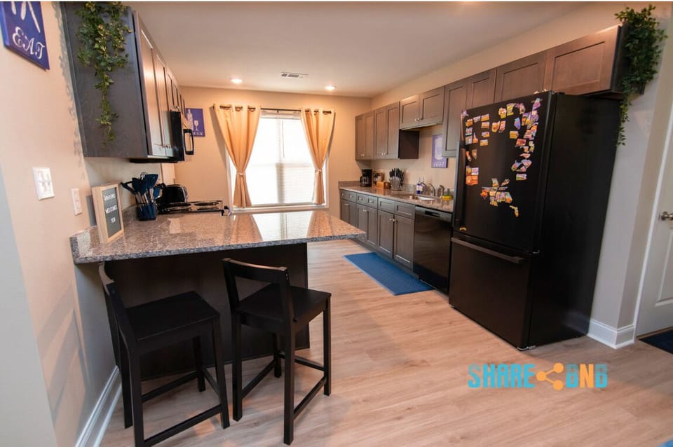 Cook up comfort in this fully stocked kitchen with modern appliances and granite countertops.