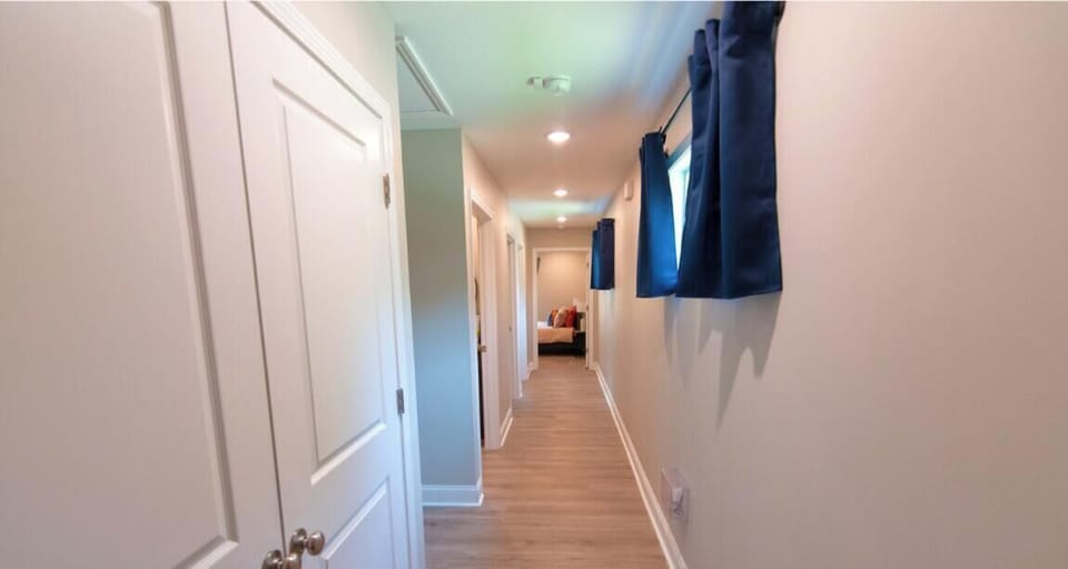 This central hallway connects you to everything — three cozy bedrooms, a full bathroom, laundry room, and more — all just steps away.