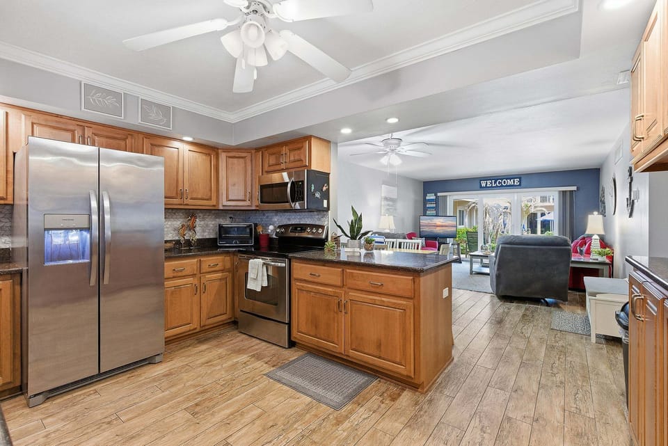 Enjoy a fully equipped kitchen with modern appliances and an open-concept living space designed for comfort after a day at the beach. Perfect for family beach stays with easy access to resort-style amenities.