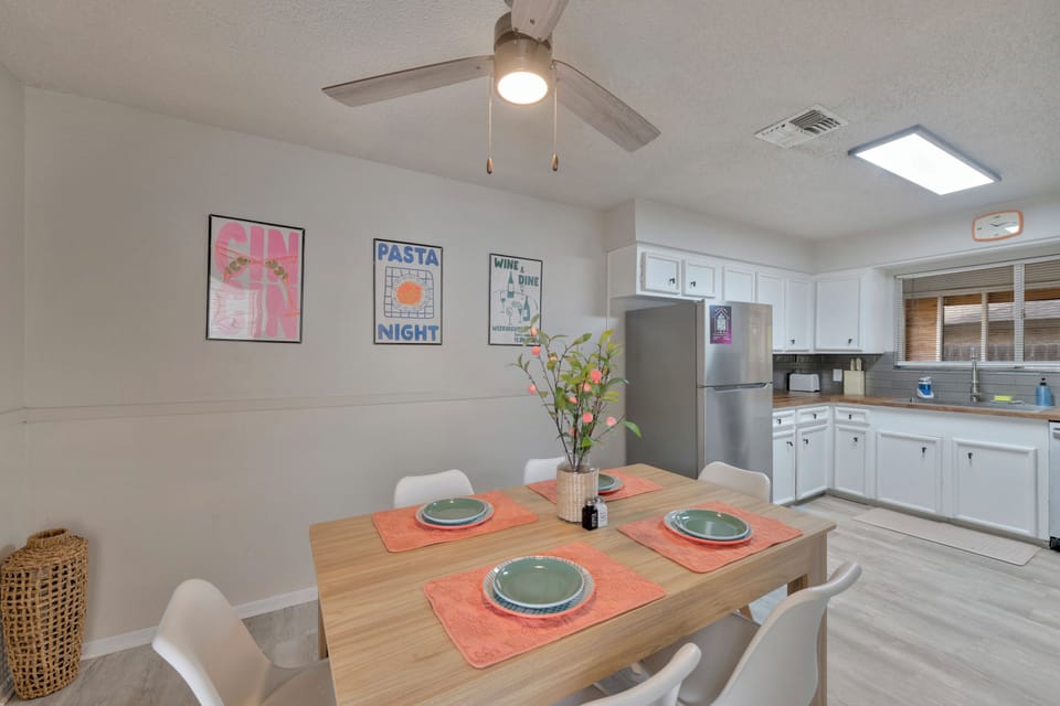 Gather around the spacious dining table for meals, board games, or planning your next beach day.