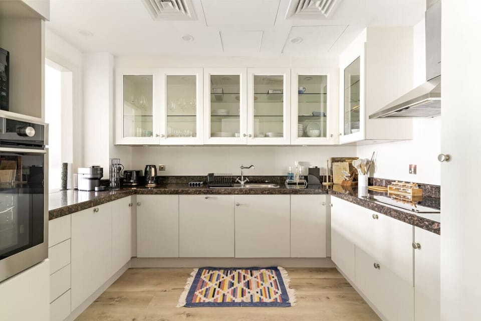 Gourmet Kitchen: Whip up delicious meals in a sleek, modern space with vibrant decor!