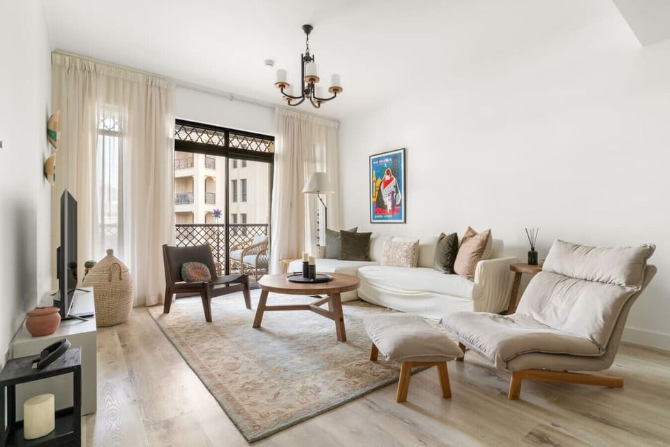 Living Room: Stylish space adorned with artwork, natural light, and inviting seating for relaxation.