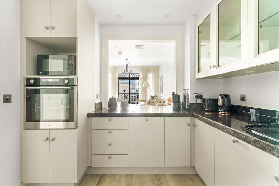 Kitchen: Sleek design with modern appliances for culinary adventures in Dubai!