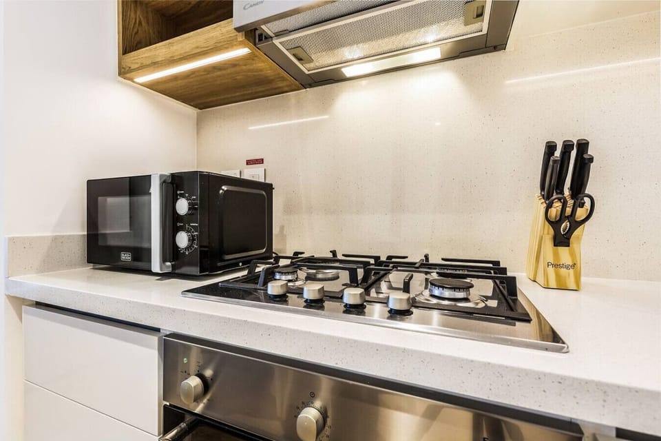 Modern Kitchen: Cook up a storm with sleek appliances and stylish finishes!