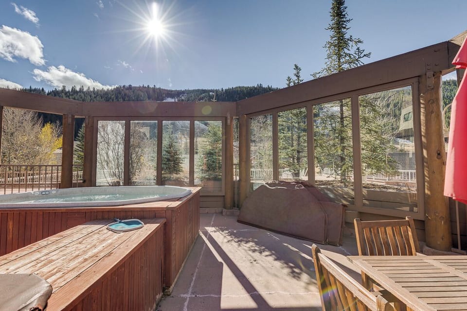 Soak in your private hot tub while surrounded by stunning mountain views and forest scenery from this peaceful covered deck.