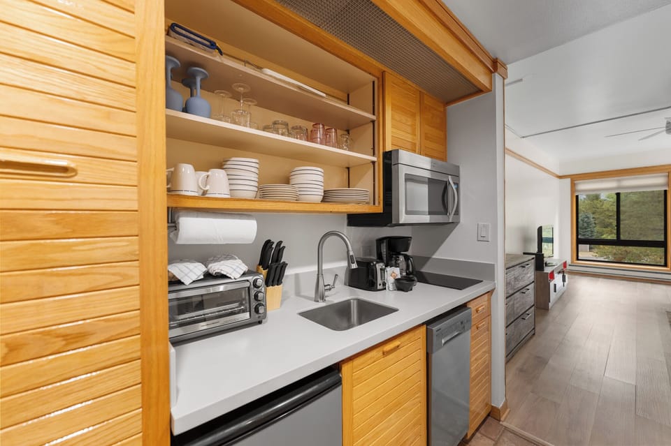 Your fully-equipped kitchen awaits with sleek appliances, ample counter space, and everything you need to create memorable meals during your stay.