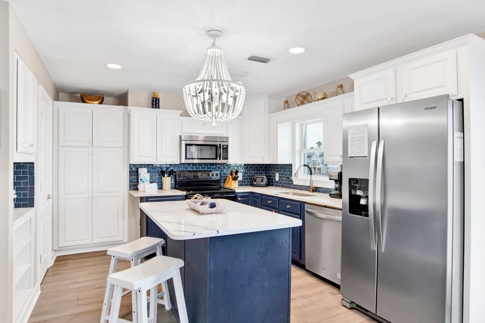 Fully equipped kitchen with stone counters and stainless appliances