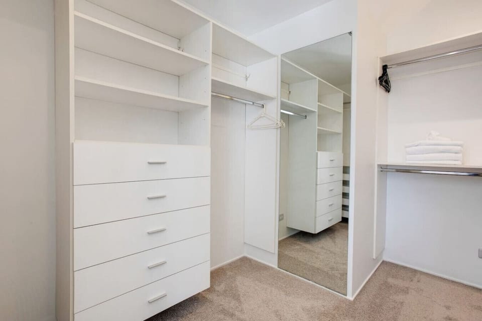 There is plenty of storage in the walk-in wardrobe in the main bedroom.