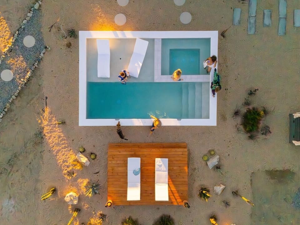 Pool or hot tub? Here, you never have to choose. Both perched above the desert with views that go on forever.