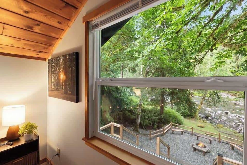 What a view to wake up to!! Open the window and fall asleep (and wake up) to the soothing sound of the river. :)