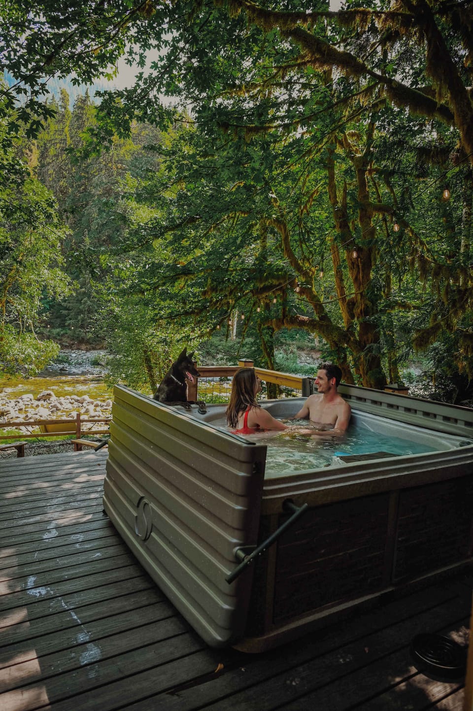 Hot tub with your honey overlooking the river...what's not to love? Oh, and your sweet pup is always welcome. Just not in the tub. :D