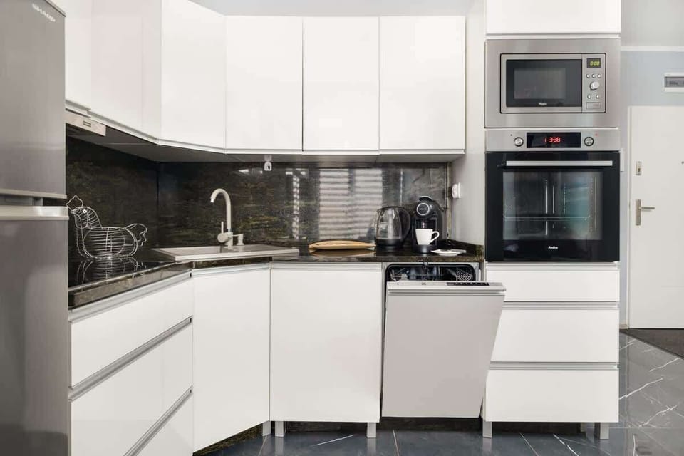 Another angle of the kitchen, showcasing its functional layout and clean design.
