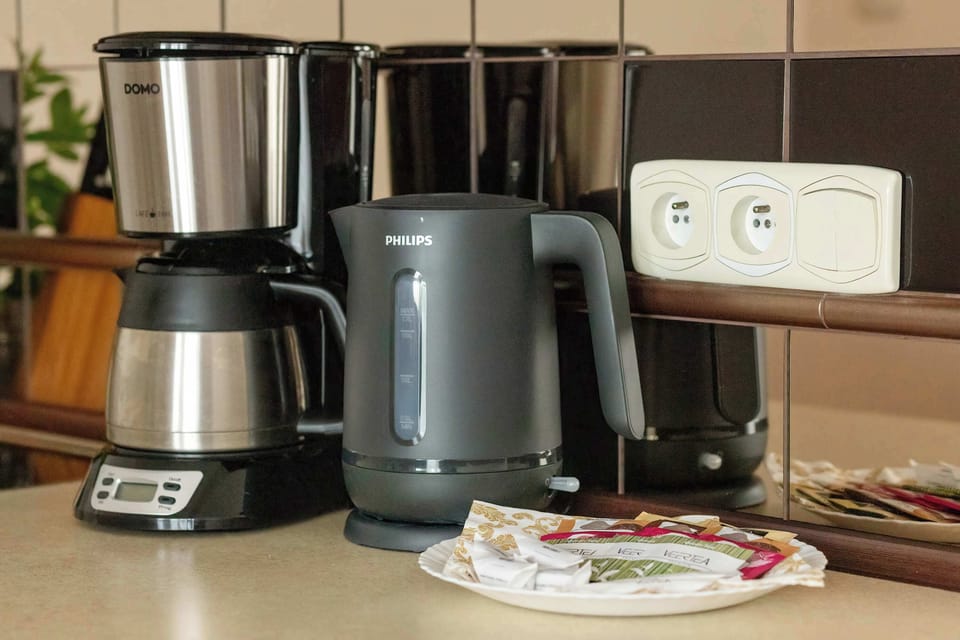 Electric kettle and coffee maker (pour-over) in the kitchenette.