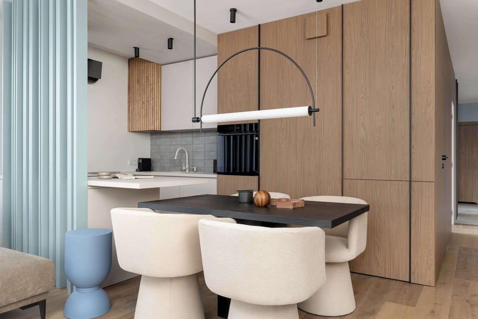 The living room's modern and stylish decor creates a welcoming atmosphere. 