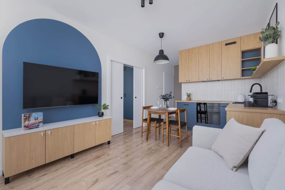 Another perspective of the relaxing living room with a TV for entertainment.

