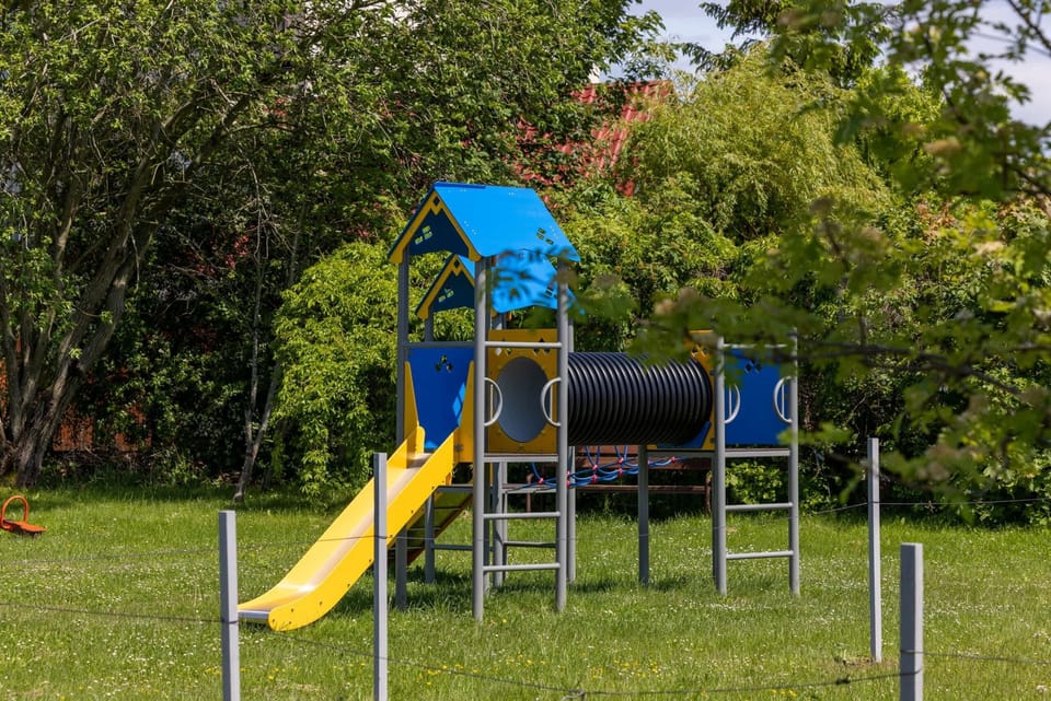 Space for children located next to the modern property building.