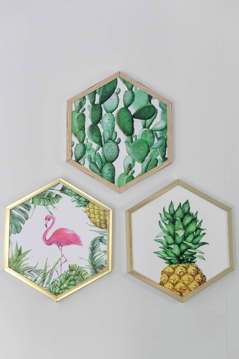 Close-up of decorative pictures, in gilded frames referring to exotic countries.
