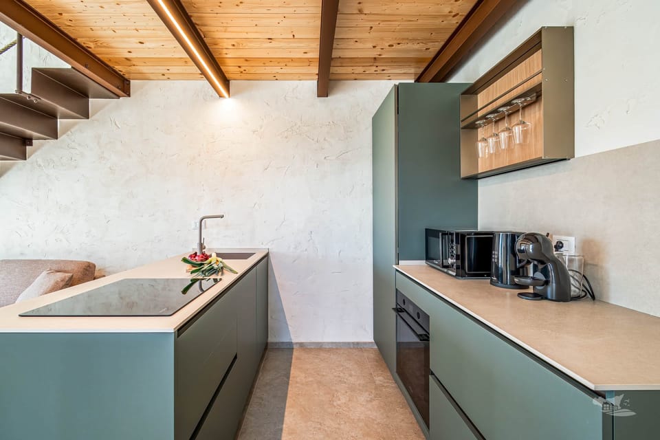 Contemporary kitchen with clean lines, open shelving, and all the essentials.
