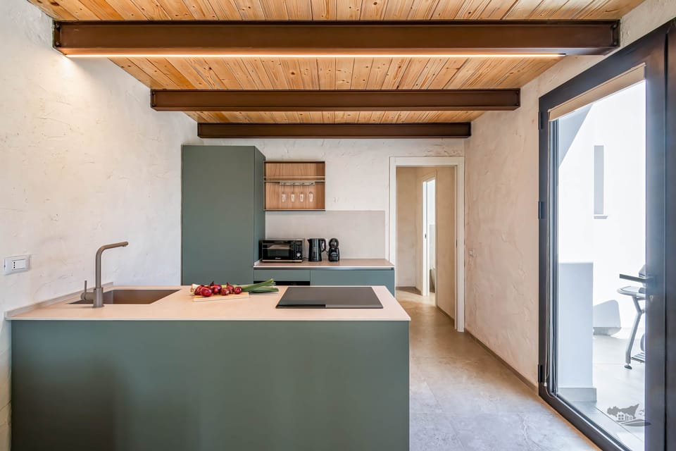 A sleek and modern kitchen featuring minimalist design, warm natural textures, and all essentials.