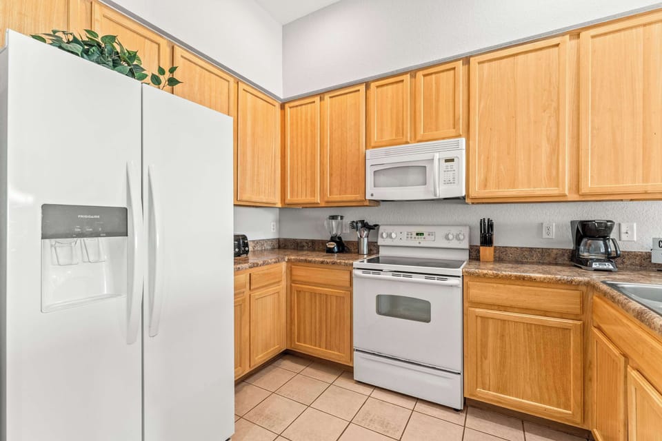 The open, airy kitchen offers ample space & every home comfort​