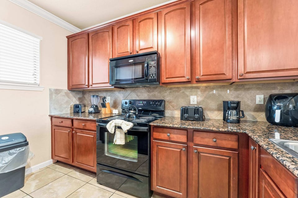 The open kitchen offers ample space & all the comforts of home​