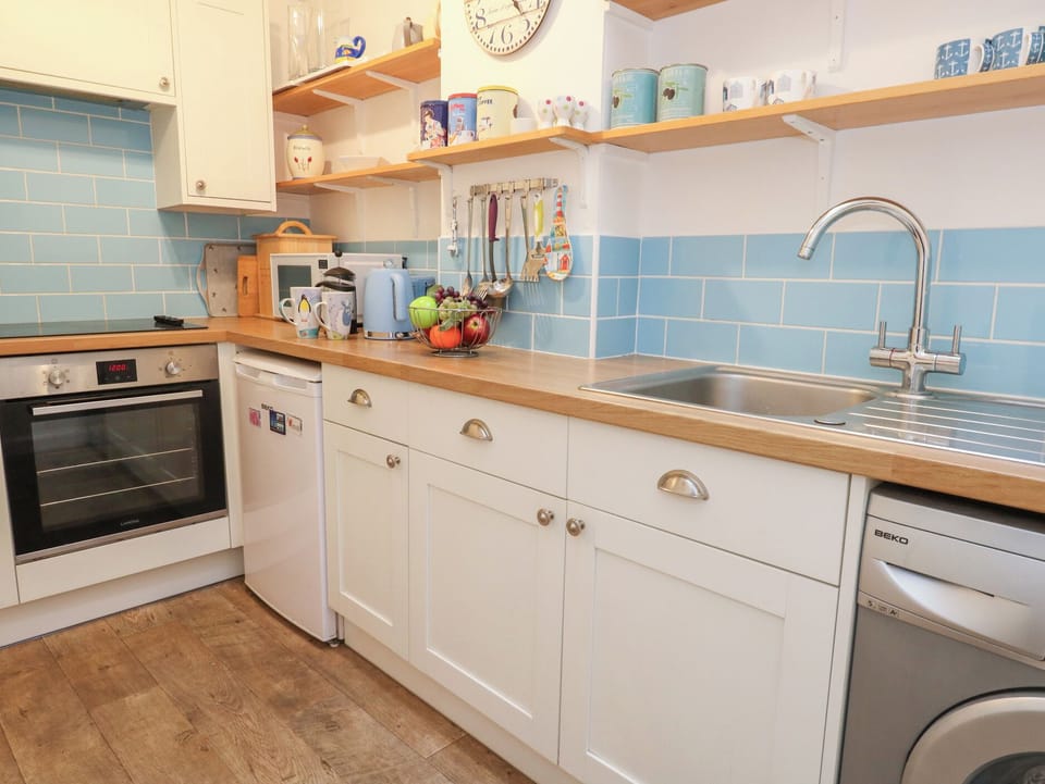 Fridge, microwave, toaster, cookware/dishes/utensils