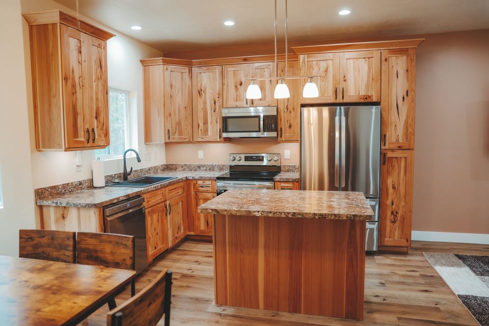 Brand new kitchen. Under cabinet lighting, dishwasher, oven, microwave, fridge.