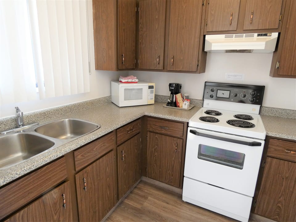 Suite, 2 Queens with a separate 1 Bedroom, Kitchen (Non-PetFriendly) | Private kitchen | Coffee/tea maker, microwave, cleaning supplies, paper towels