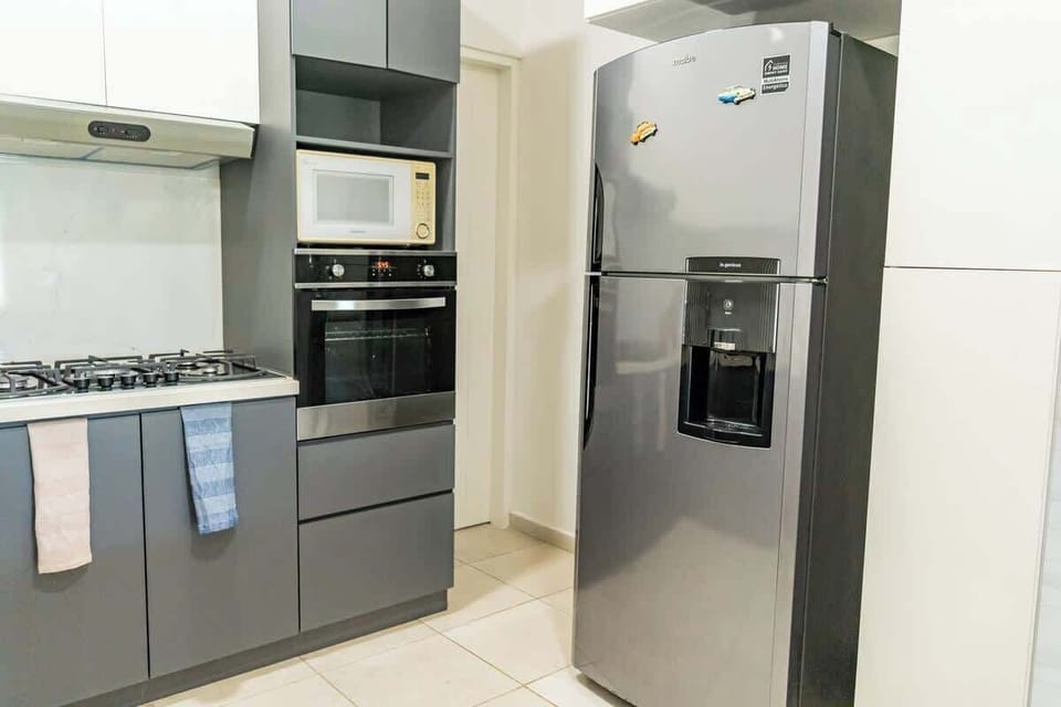 Kitchen with refrigerator and oven