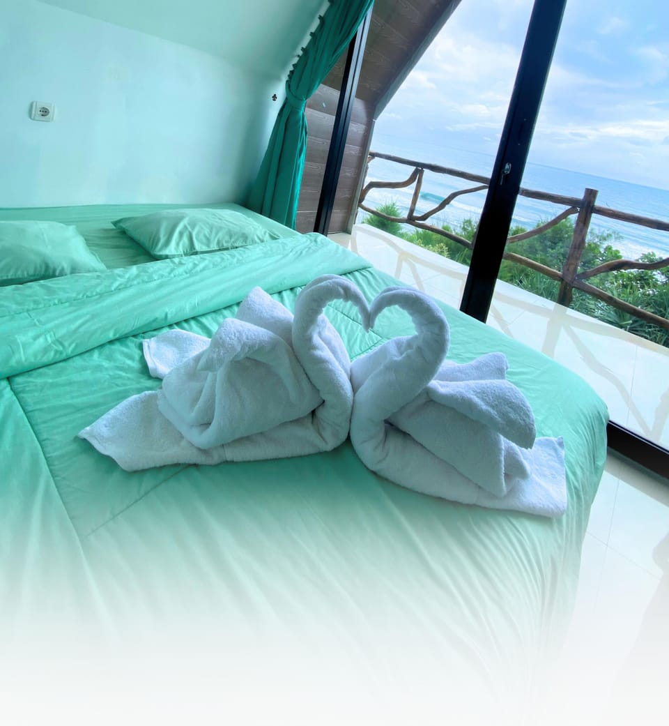 Deluxe Double Room, Beach View | Desk, laptop workspace, free WiFi