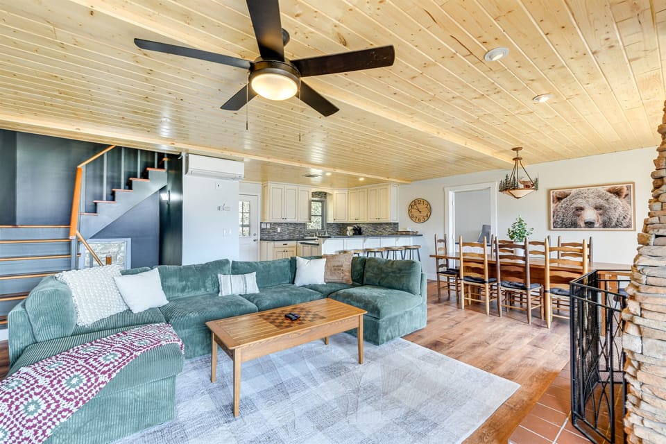 Living Room: Stylish design meets comfort, featuring ample seating and warm wood accents!