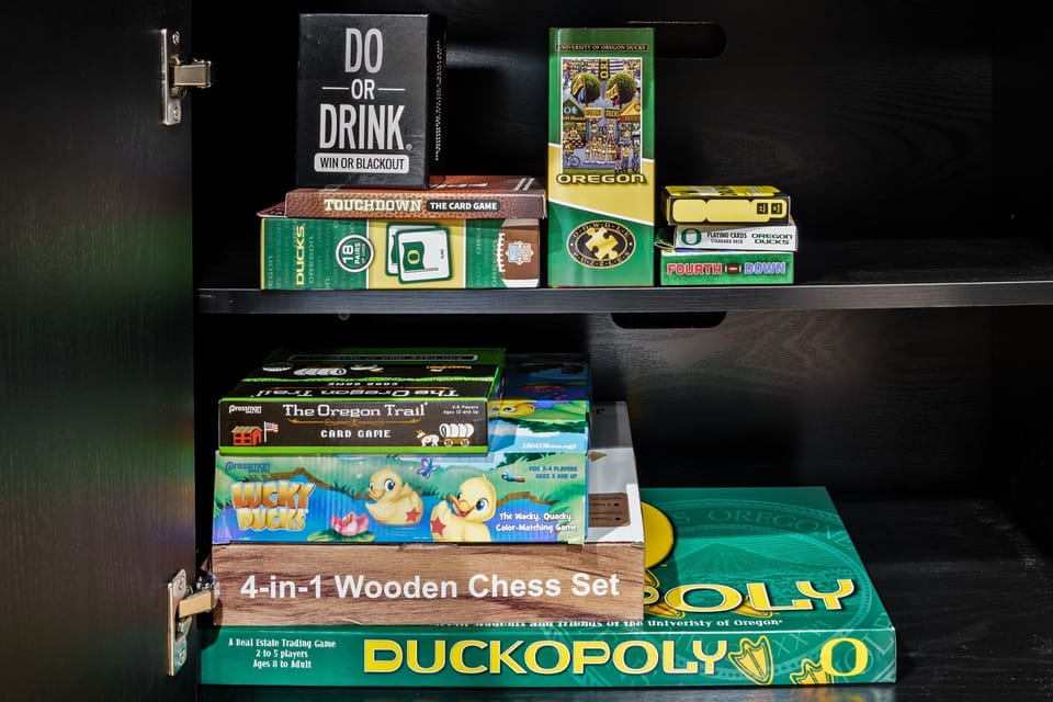 Game cupboard with board games, cards, and activities for all ages. 