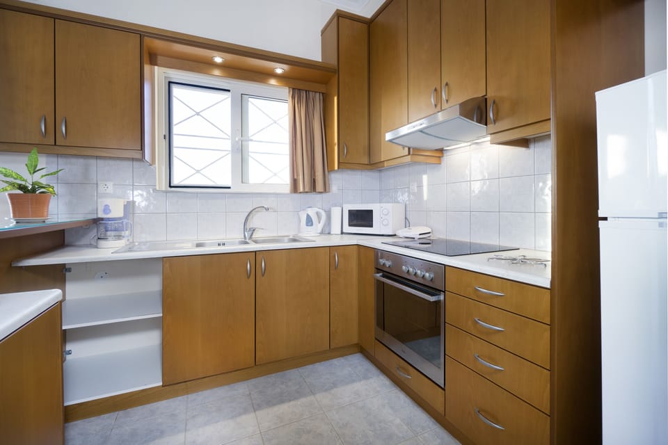 Deluxe Apartment, 2 Bedrooms | Private kitchen | Full-size fridge, microwave, oven, stovetop