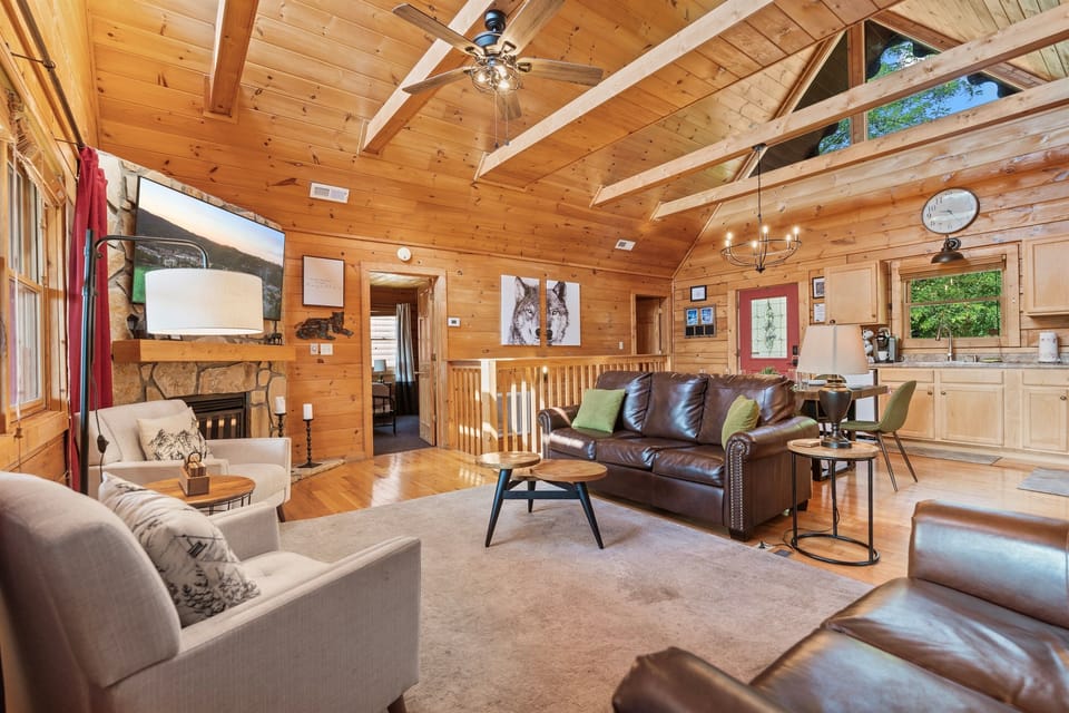 Spacious living room with vaulted ceilings, natural light, and plenty of seating for everyone to gather comfortably.