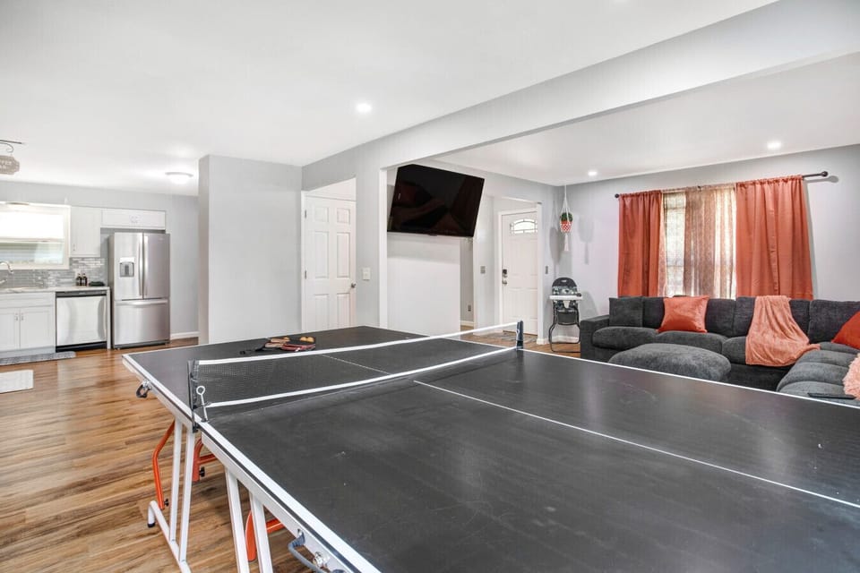 Fun-filled game room featuring ping pong and a second lounge area for entertainment